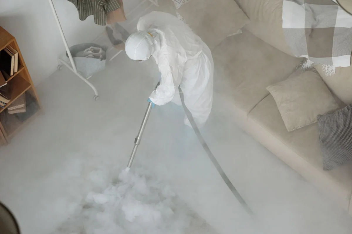 Biohazard cleanup technician in protective equipment, Forest Hills, Tampa, FL